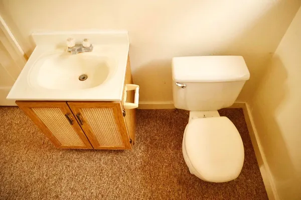 a bathroom with a toilet and a sink