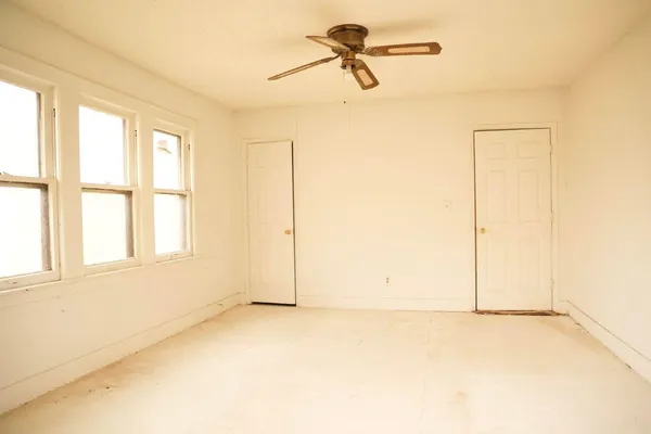 an empty room with a empty space and a window