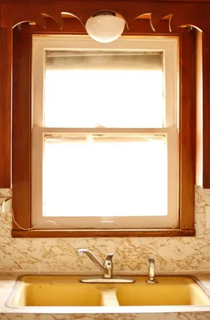 a view of an empty room and a window