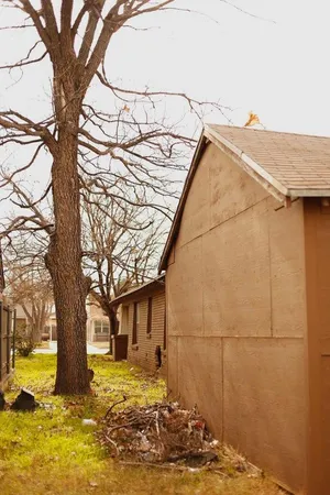a view of a house with snow on the tree