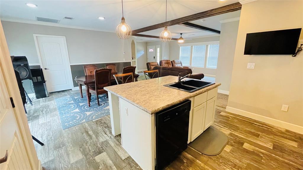 8394 Lake Road Mansfield, TX 76063 - Photo 14 of 22 a kitchen that has a microwave a table and chairs in it