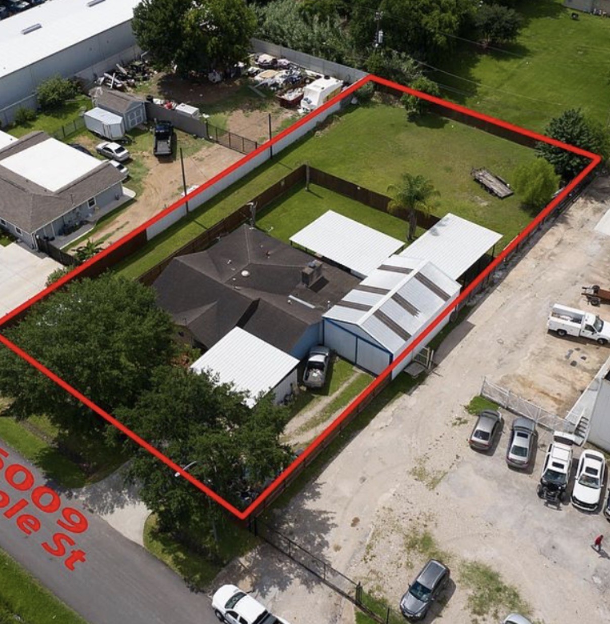 6009 Maple Street Houston, TX 77074 - Photo 1 of 11 an aerial view of a tennis ground and a cars park side of the road