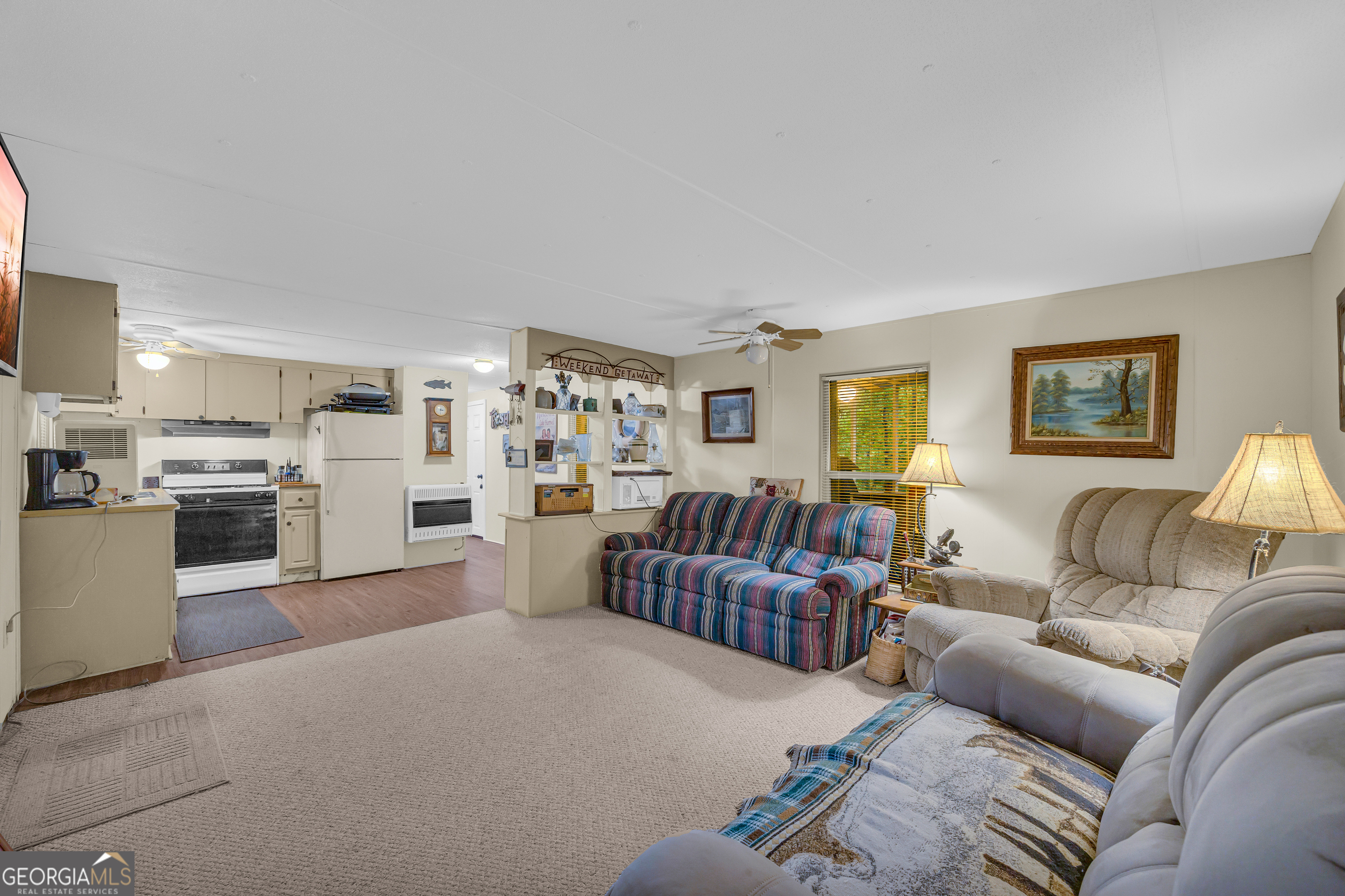 23 Wren Court Toccoa, GA 30577 - Photo 11 of 26 a living room with furniture and a kitchen