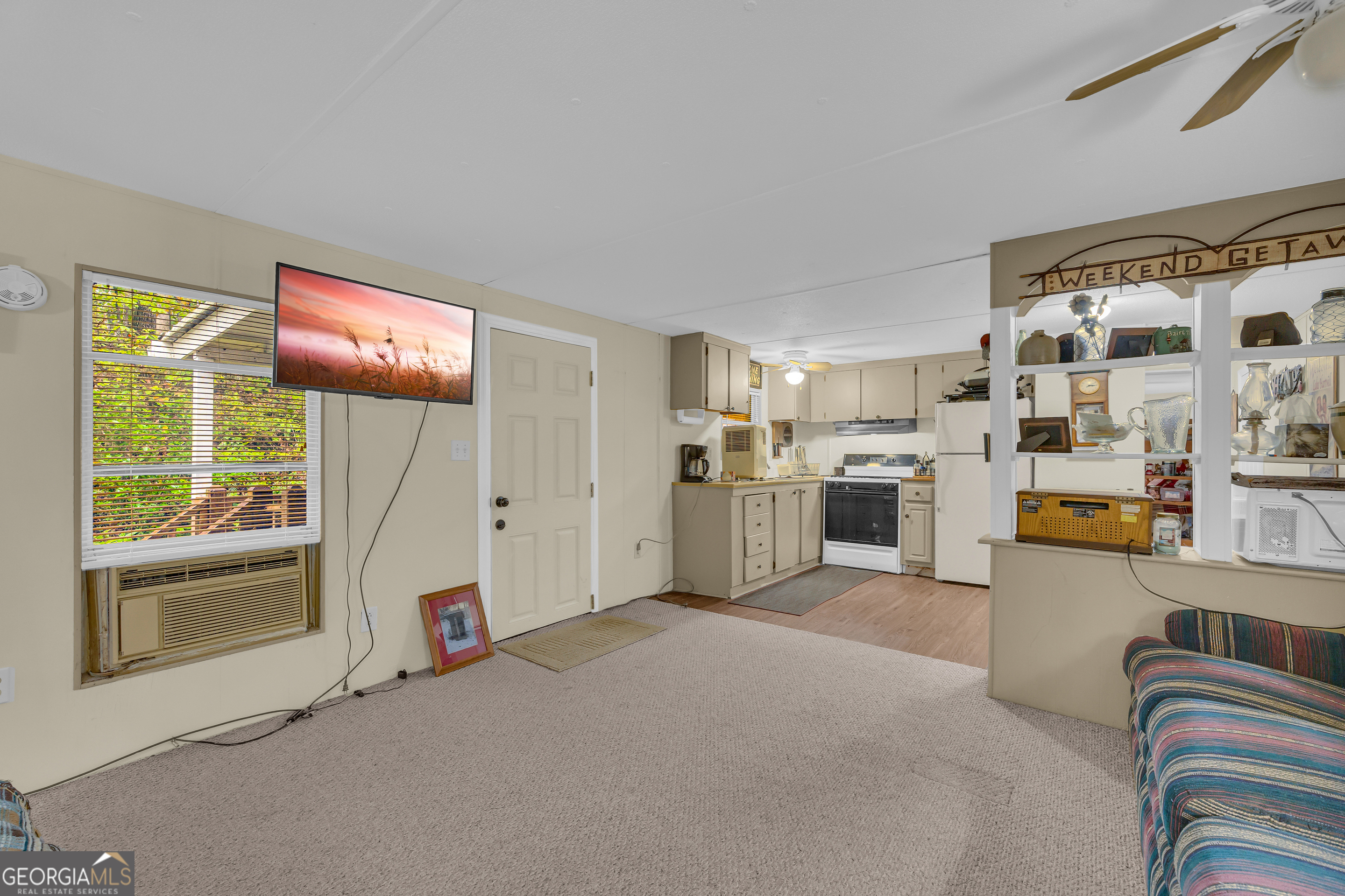 23 Wren Court Toccoa, GA 30577 - Photo 12 of 26 a living room with furniture and a flat screen tv