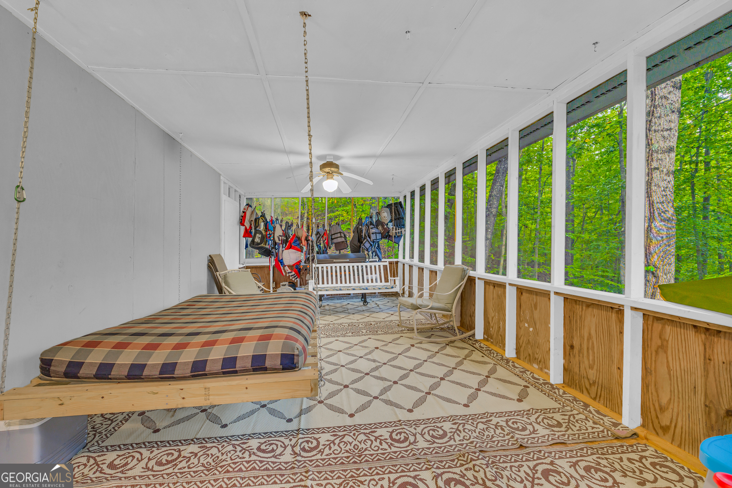 23 Wren Court Toccoa, GA 30577 - Photo 19 of 26 a bedroom with a bed a chandelier and large window