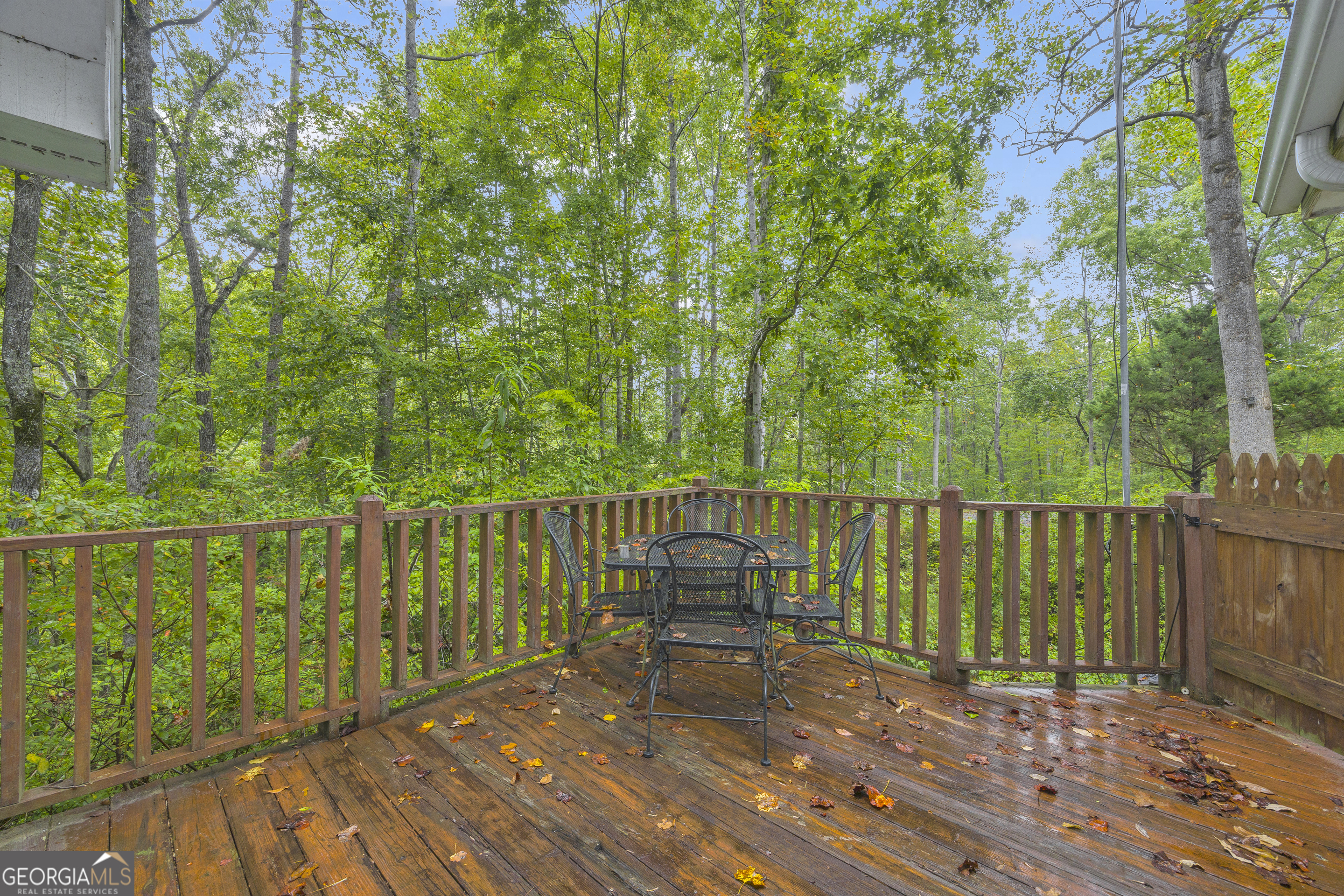23 Wren Court Toccoa, GA 30577 - Photo 22 of 26 a balcony with wooden floor and fence