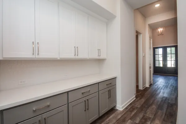 a view of cabinets and wooden floor