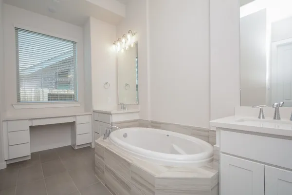 a bathroom with a bathtub and a sink