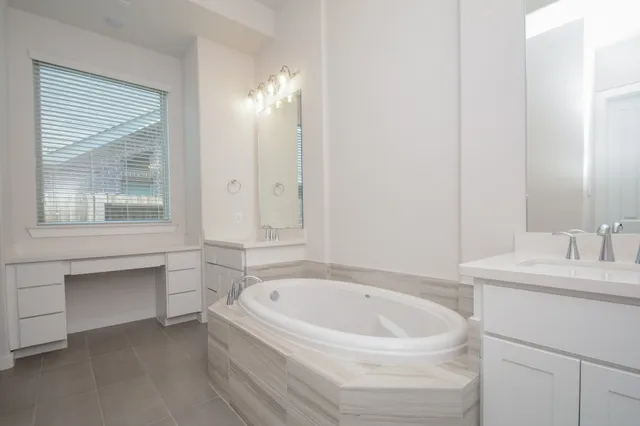 a bathroom with a bathtub and a sink