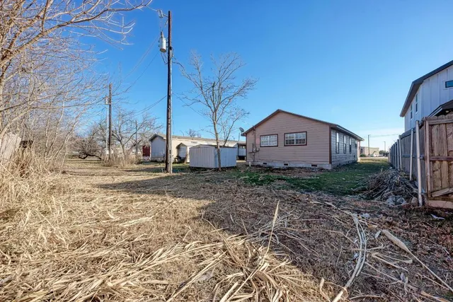 a house view with a backyard space