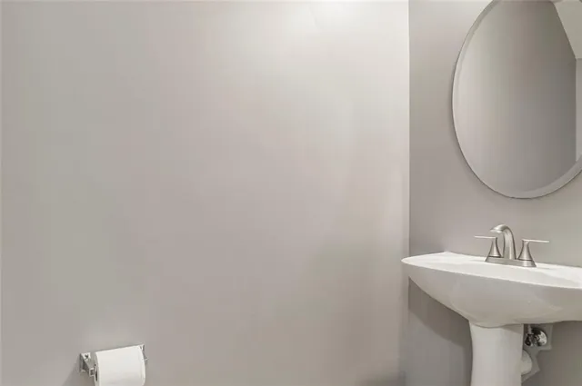 a bathroom with a sink and mirror