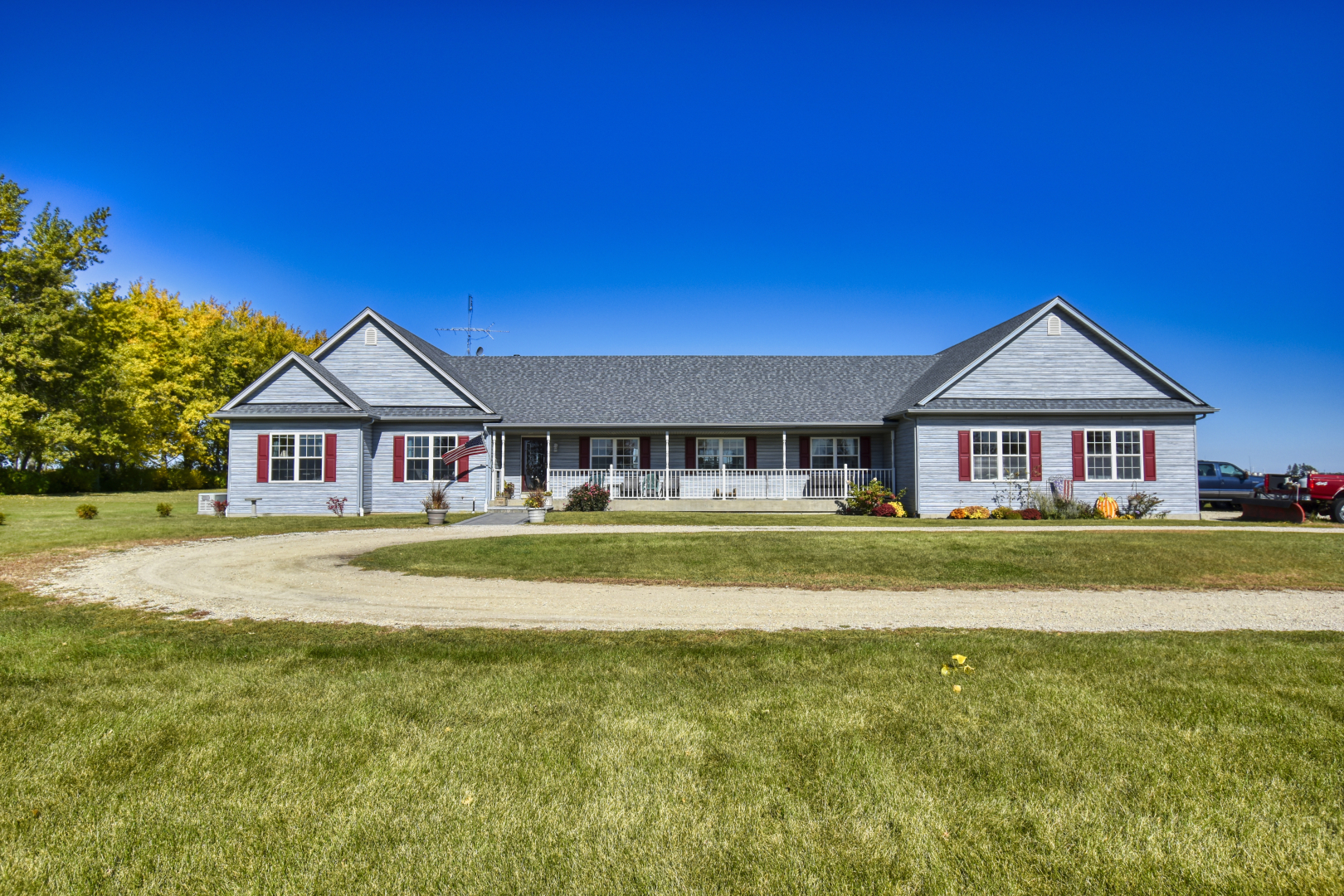 3322 Chicago Road Paw Paw, IL 61353 - Photo 1 of 37 a view of a house with a big yard and large trees