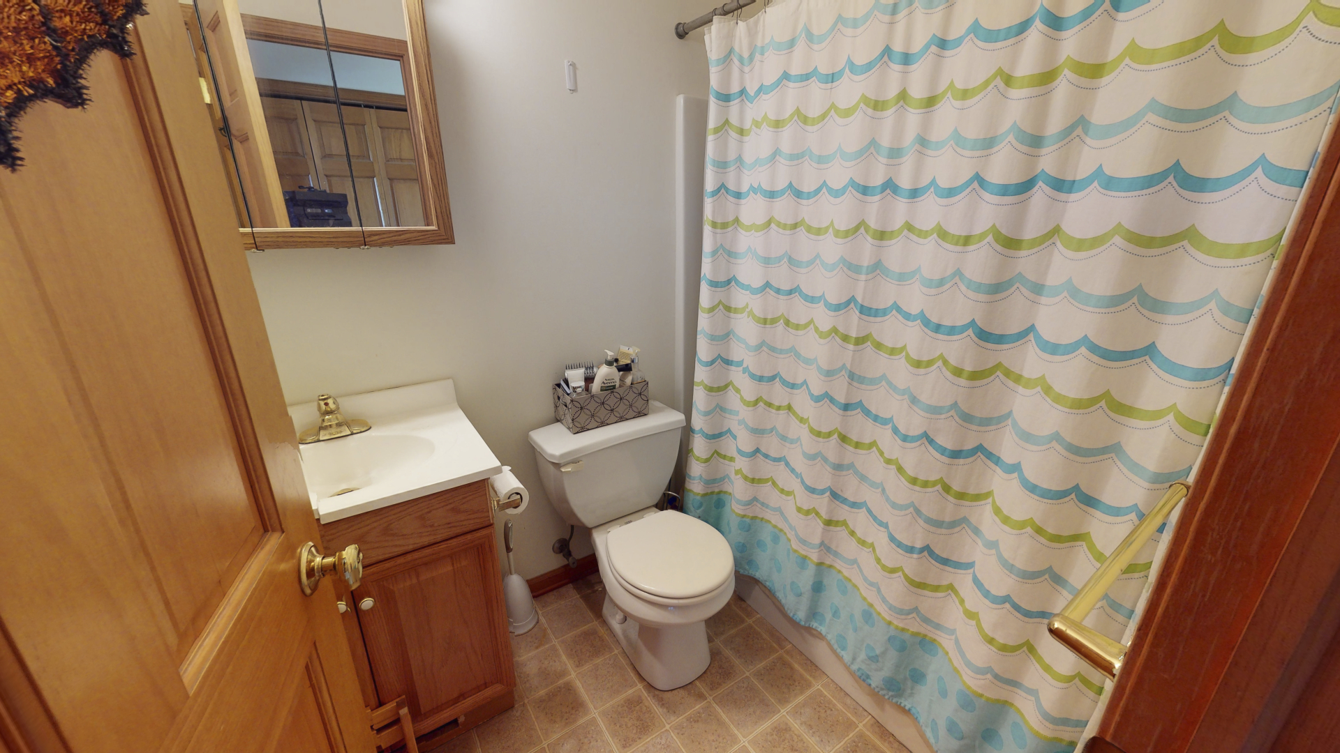 3322 Chicago Road Paw Paw, IL 61353 - Photo 14 of 37 a white toilet sitting next to a shower curtain