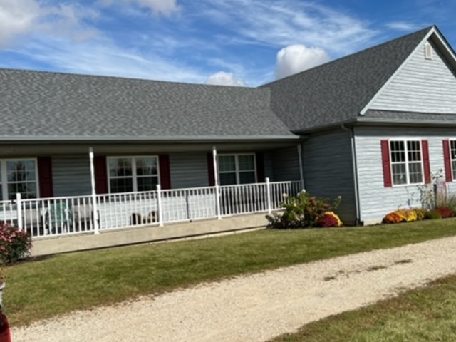 3322 Chicago Road Paw Paw, IL 61353 - Photo 4 of 37 a front view of a house with a yard