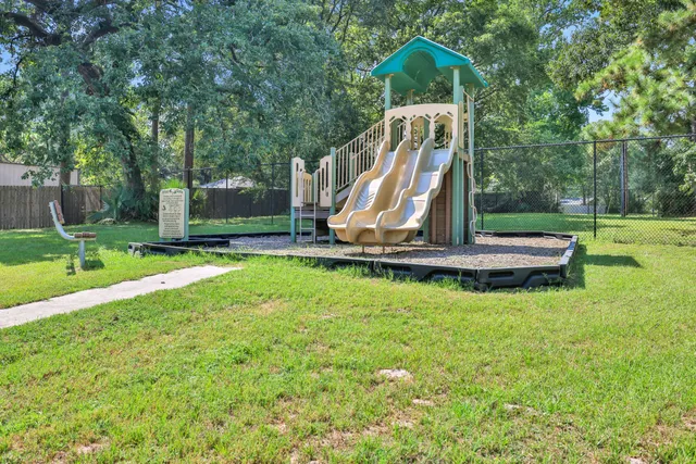 a view of a lake with houses in the back