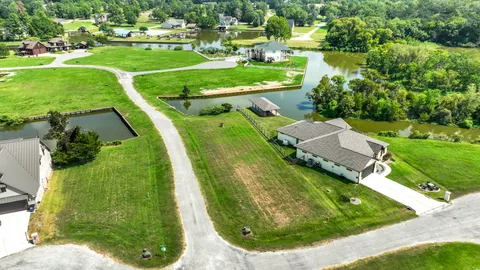 a view of a lake with a yard