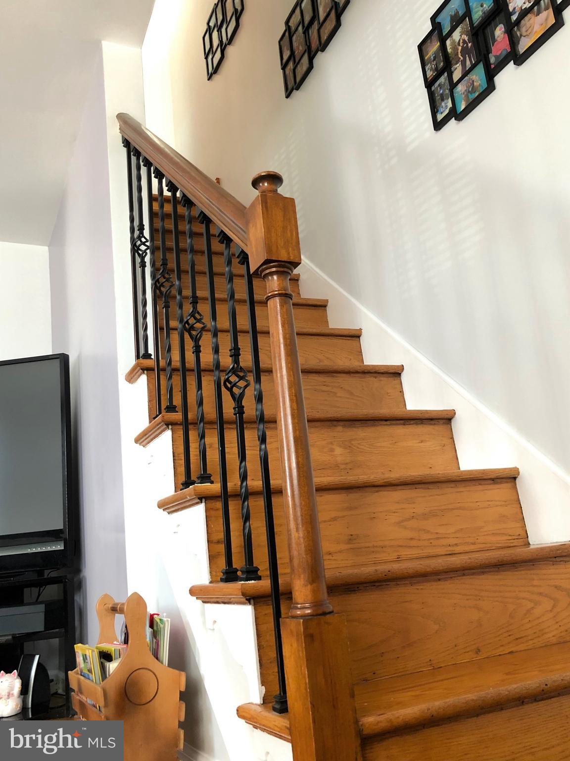 3530 Decatur Street Philadelphia, PA 19136 - Photo 7 of 32 Hardwood staircase with new wrought iron spindles