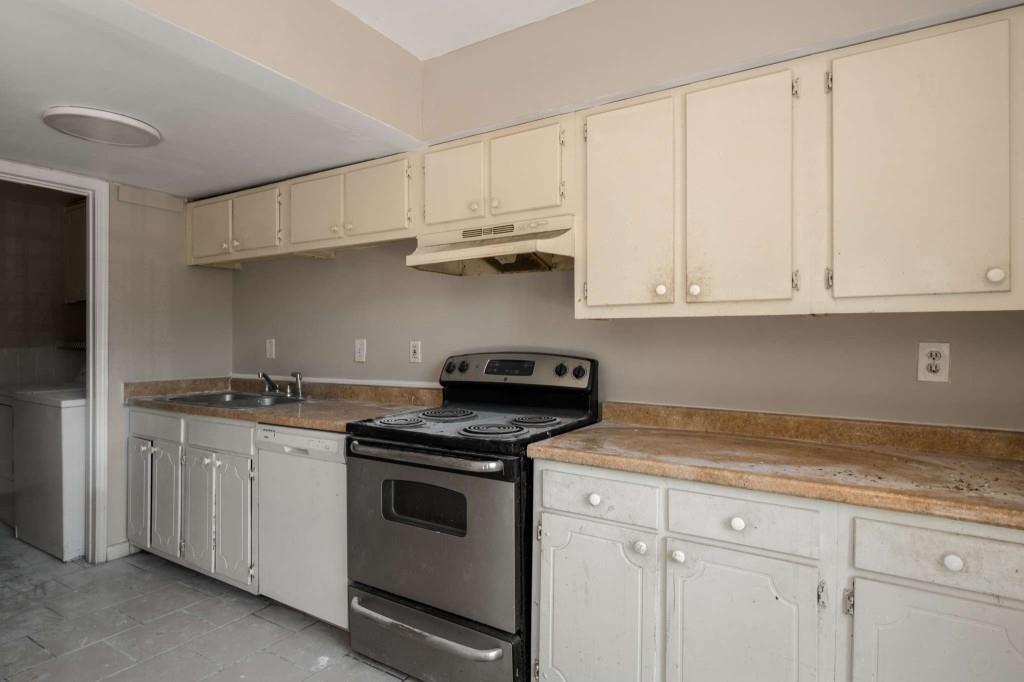 3254 Strawberry Lane Decatur, GA 30034 - Photo 8 of 15 a kitchen with stainless steel appliances granite countertop white cabinets and a stove top oven