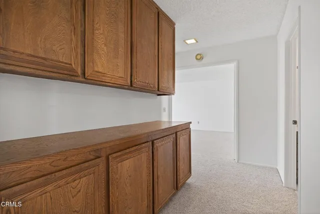 a view of cabinets and wooden floor