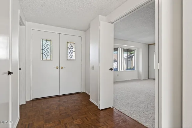 a view of a hallway with closet area