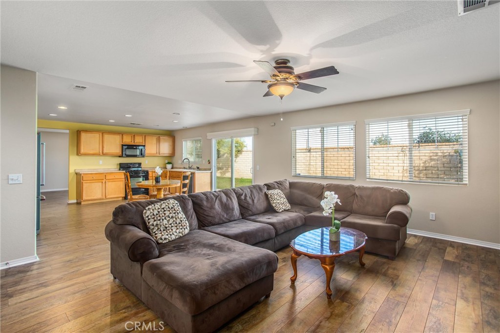 4423 Candelaria Way Perris, CA 92571 - Photo 16 of 42 a living room with furniture and a large window