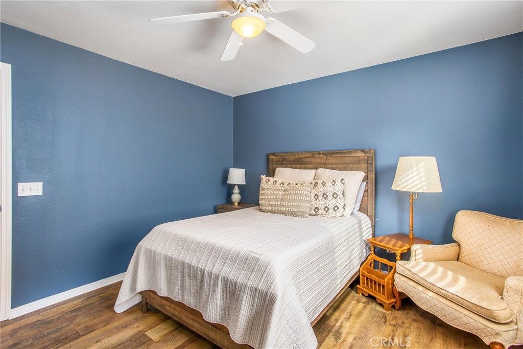 4423 Candelaria Way Perris, CA 92571 - Photo 19 of 42 a bedroom with a bed and a couch