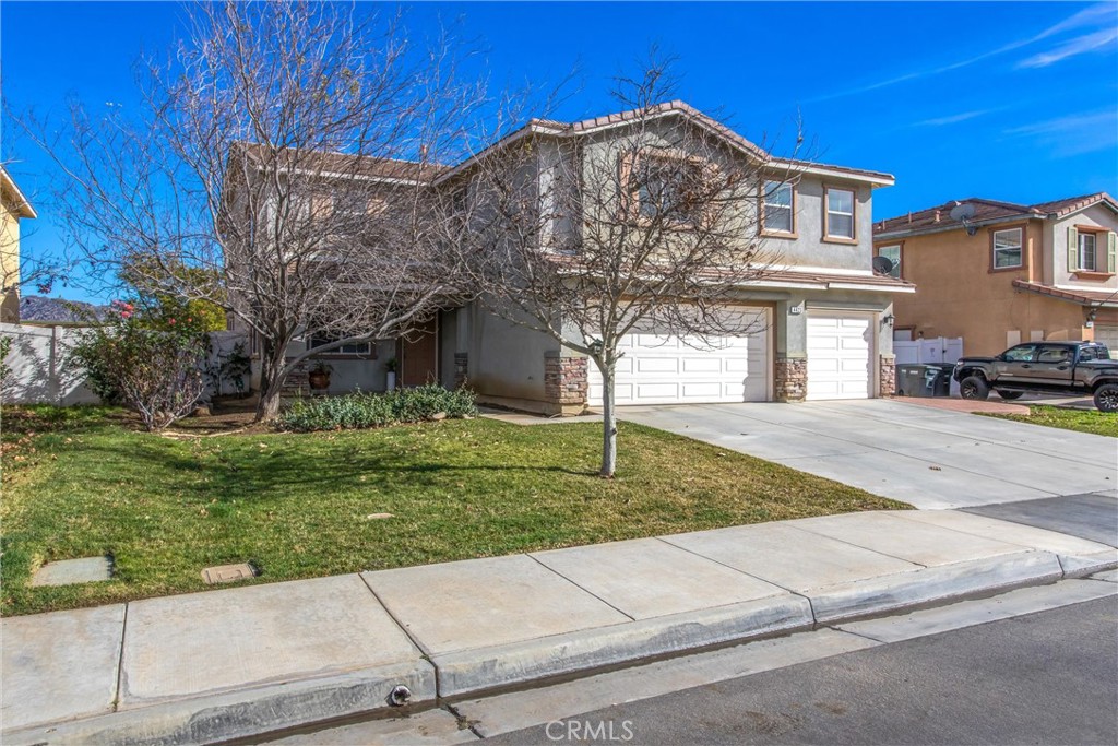 4423 Candelaria Way Perris, CA 92571 - Photo 2 of 42 a front view of a house with a yard