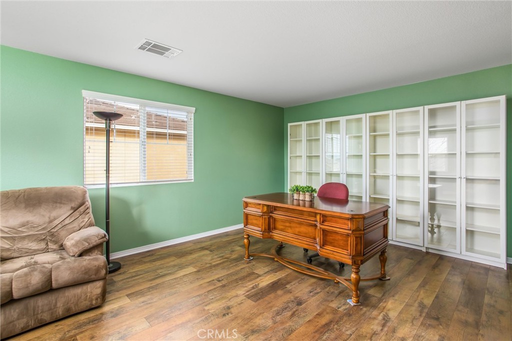 4423 Candelaria Way Perris, CA 92571 - Photo 21 of 42 a living room with furniture and a window