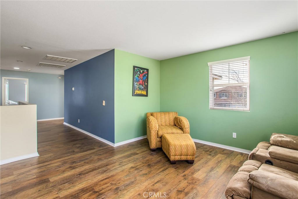 4423 Candelaria Way Perris, CA 92571 - Photo 23 of 42 a room with wooden floor and a window
