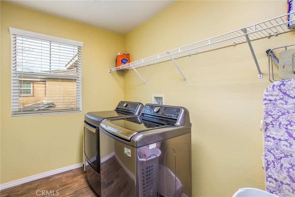 4423 Candelaria Way Perris, CA 92571 - Photo 24 of 42 a utility room with dryer and washer