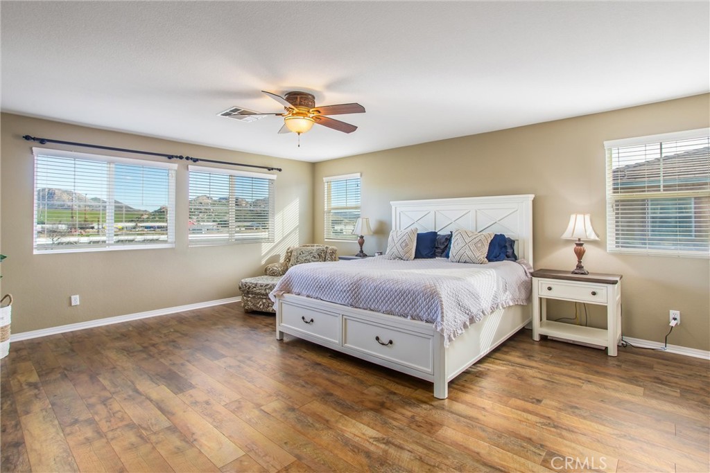 4423 Candelaria Way Perris, CA 92571 - Photo 30 of 42 a bedroom with a large bed and a window
