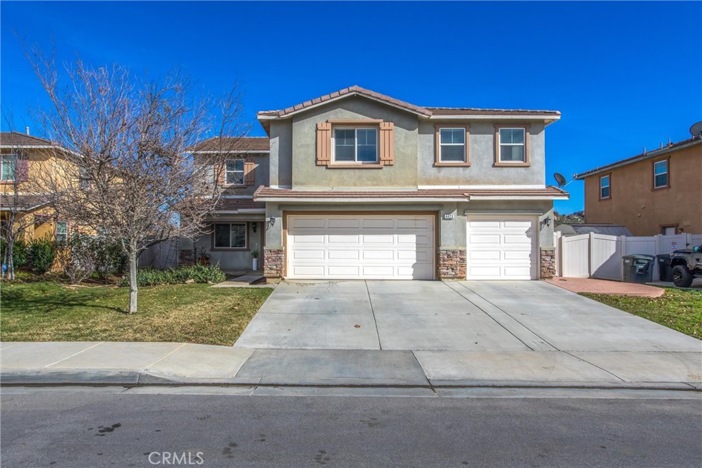 4423 Candelaria Way Perris, CA 92571 - Photo 3 of 42 a front view of a house with garden