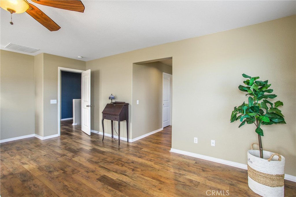 4423 Candelaria Way Perris, CA 92571 - Photo 32 of 42 a living room with furniture and a potted plant