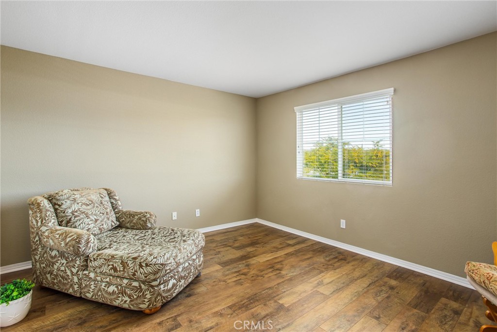 4423 Candelaria Way Perris, CA 92571 - Photo 34 of 42 a living room with furniture and a window