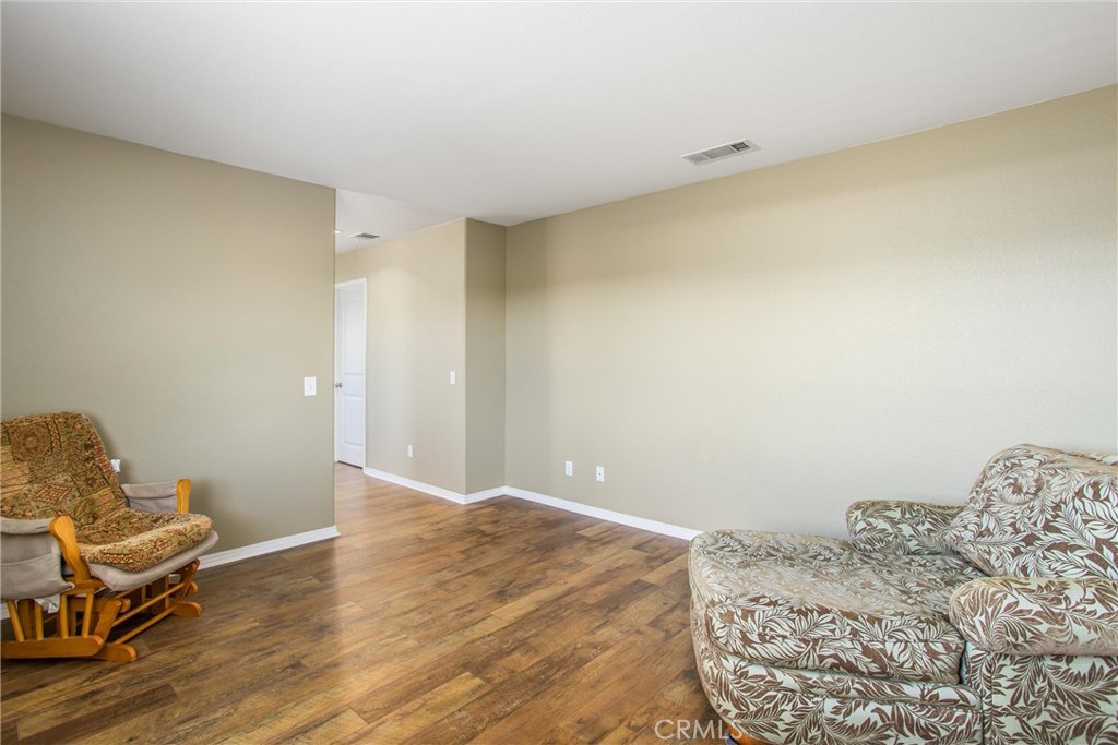 4423 Candelaria Way Perris, CA 92571 - Photo 35 of 42 a bedroom with a bed and a window