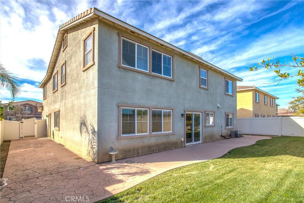 4423 Candelaria Way Perris, CA 92571 - Photo 37 of 42 a backyard of a house with yard and outdoor seating
