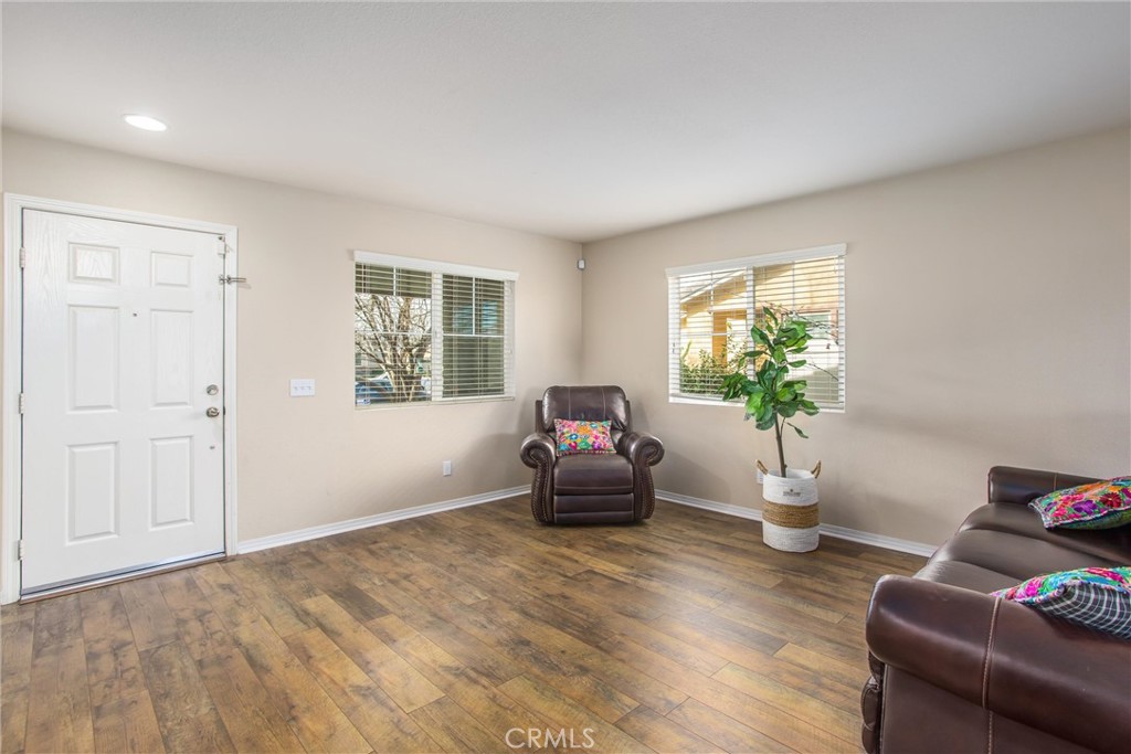 4423 Candelaria Way Perris, CA 92571 - Photo 5 of 42 a living room with furniture and a potted plant
