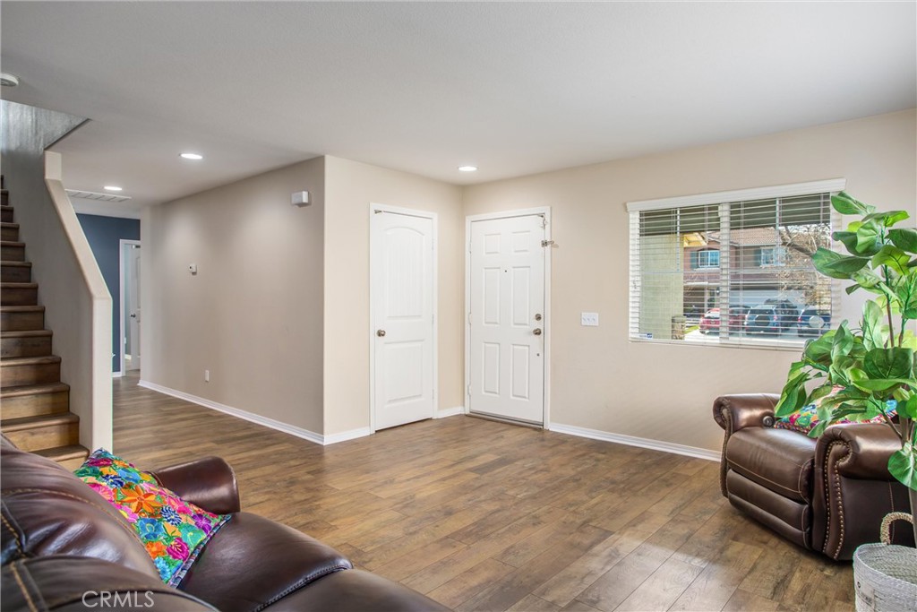 4423 Candelaria Way Perris, CA 92571 - Photo 6 of 42 a living room with furniture and a potted plant
