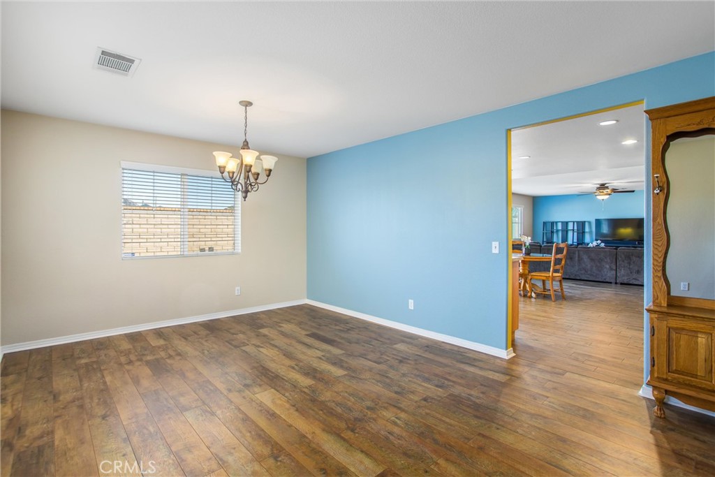4423 Candelaria Way Perris, CA 92571 - Photo 8 of 42 a view of livingroom with hardwood floor and a ceiling fan