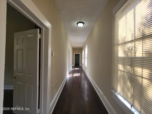 a view of a hallway with windows