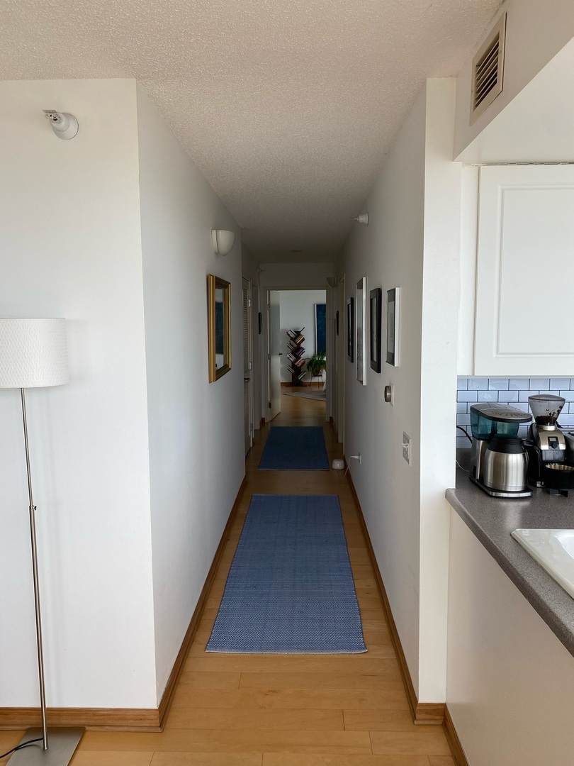 1720 Maple Avenue, Unit 2120 Evanston, IL 60201 - Photo 12 of 21 a view of a kitchen from the hallway