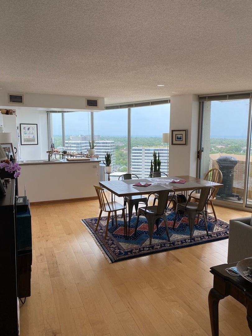 1720 Maple Avenue, Unit 2120 Evanston, IL 60201 - Photo 5 of 21 a kitchen with a table chairs and a stove