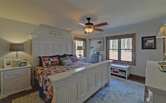 a spacious bathroom with a double vanity sink and a large mirror