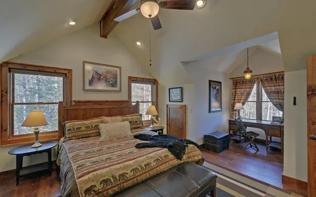 a living room with fireplace furniture and a flat screen tv