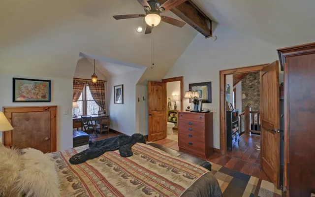 a room with furniture a flat screen tv and a fireplace