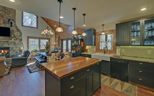 a large kitchen with a table and chairs