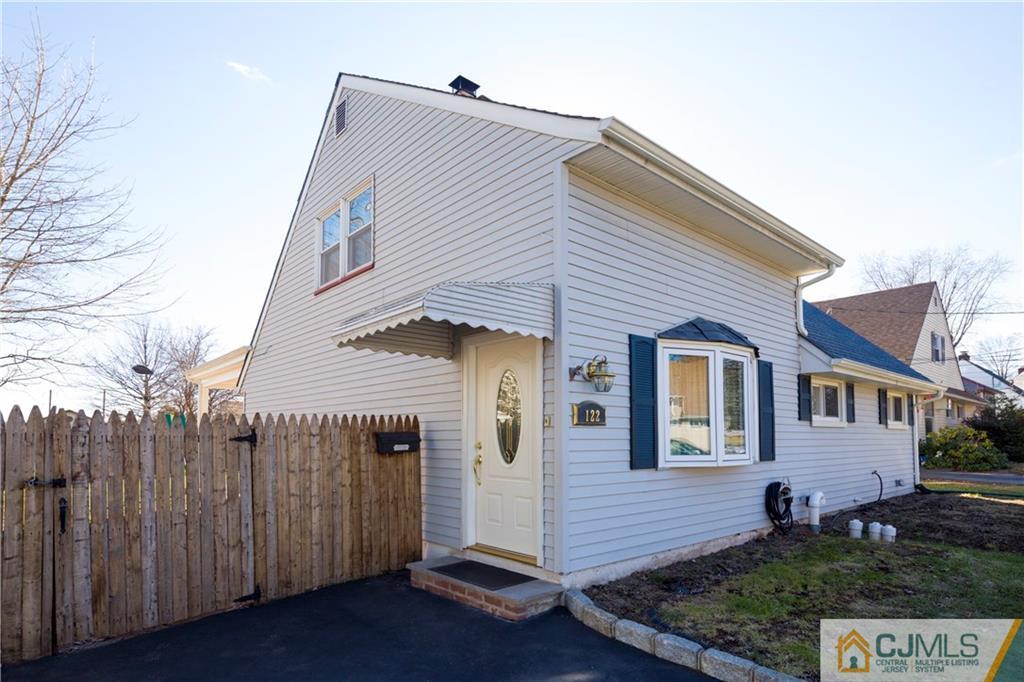 122 Ridge Road Colonia, NJ 07067 - Photo 2 of 25 a front view of a house with garden