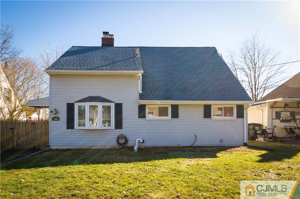 122 Ridge Road Colonia, NJ 07067 - Photo 3 of 25 a front view of a house with yard
