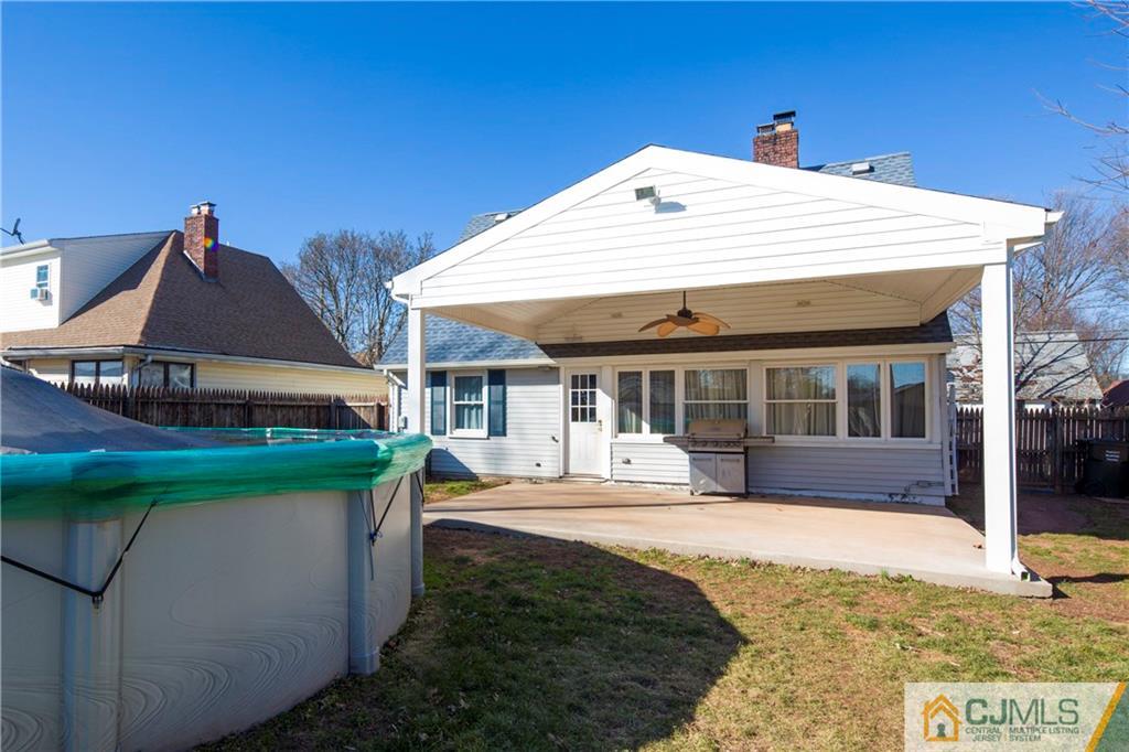 122 Ridge Road Colonia, NJ 07067 - Photo 25 of 25 a view of a house with a yard and sitting area