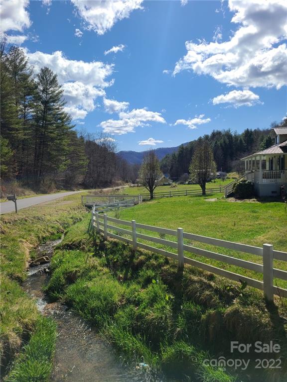 1411 Bailey Branch Road Burnsville, NC 28714 - Photo 2 of 40 a view of a golf course with a lake